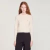 Gepolsterte, kurz geschnittene Strickjacke mit Rundhalsausschnitt