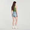 Jeansshorts mit Lederdetails