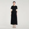 Maxikleid aus Strick mit Schößchen