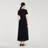 Maxikleid aus Strick mit Schößchen