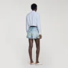 Shorts aus Jeans und Wildleder mit Nieten
